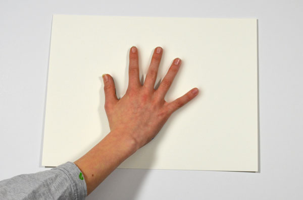 Press the hand onto the paper